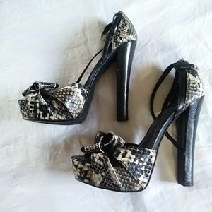 Sky high heeled snake skin platforms